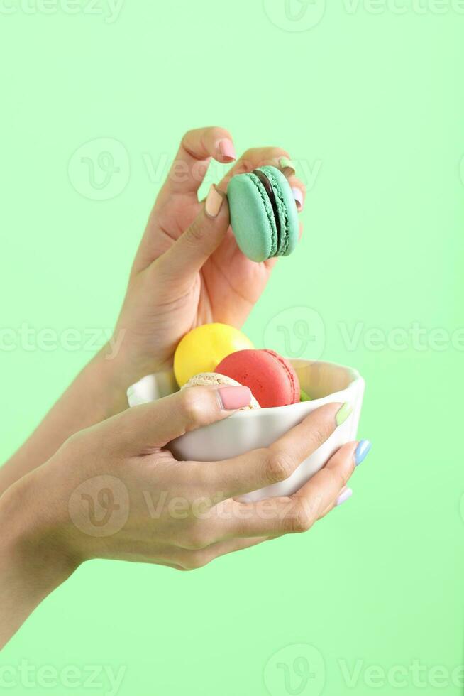 Hand with Macaroons photo