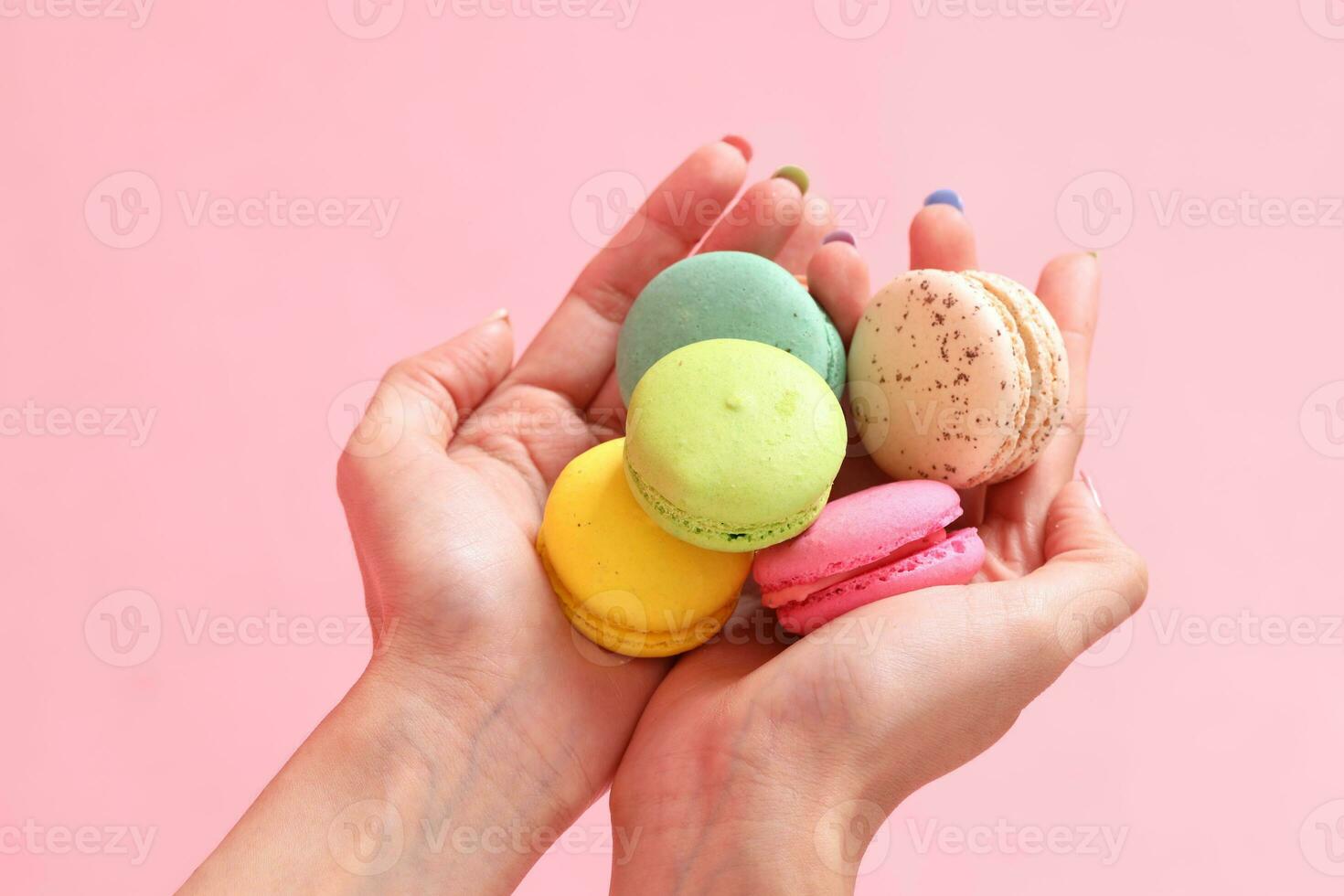 Hand with Macaroons photo