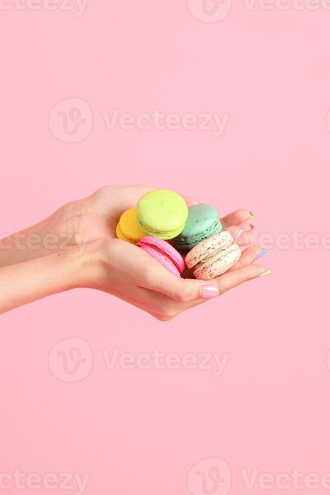 Hand with Macaroons photo