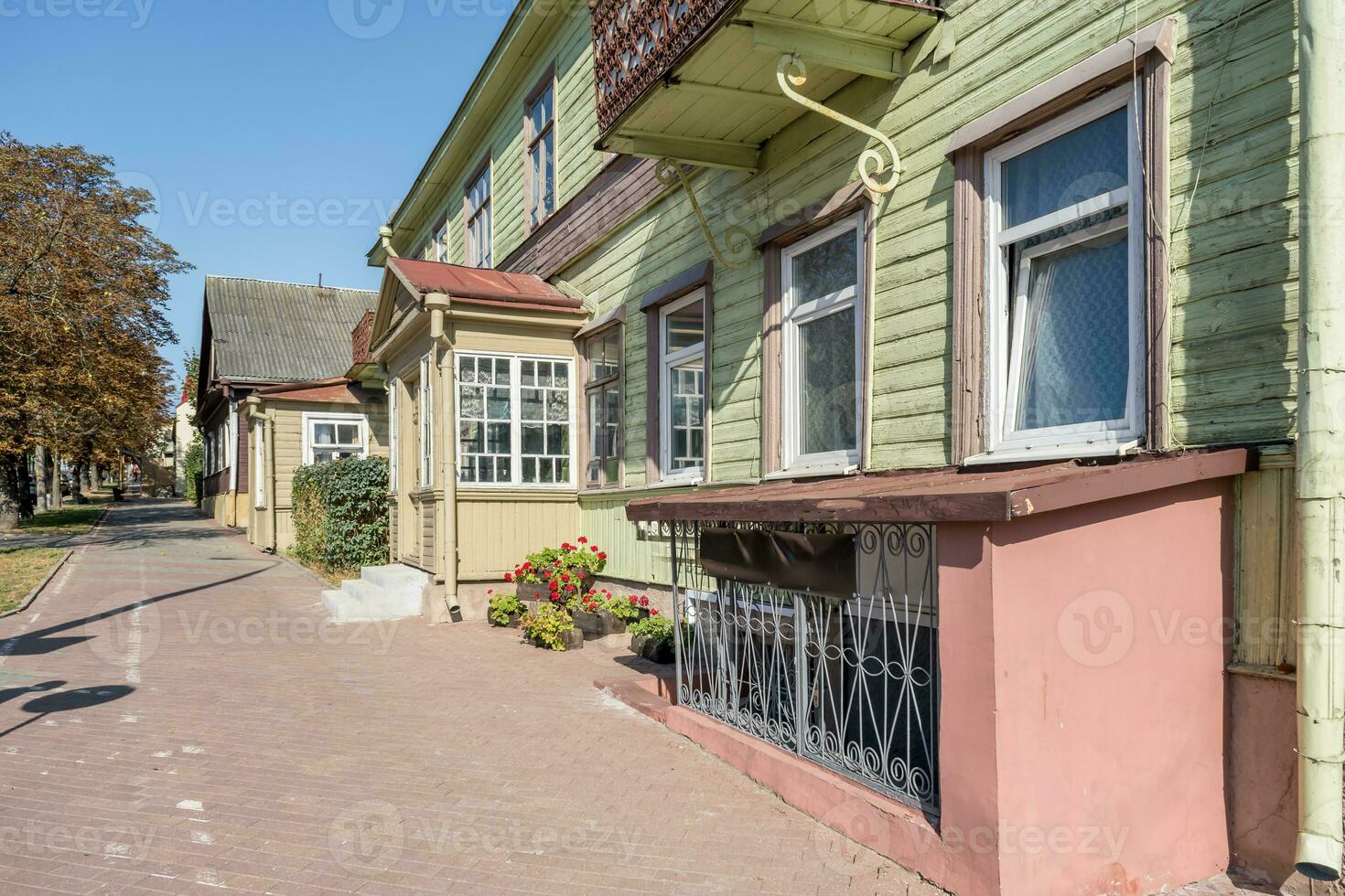 example of hundred-year-old historical old wooden building and homestead of private sector in wooden constructivism style photo