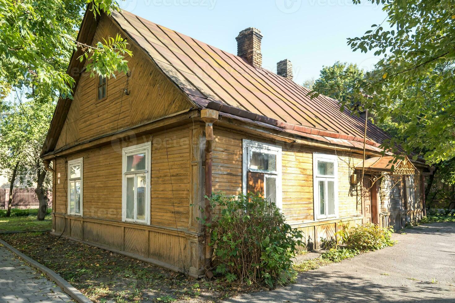 example of hundred-year-old historical old wooden building and homestead of private sector in wooden constructivism style photo