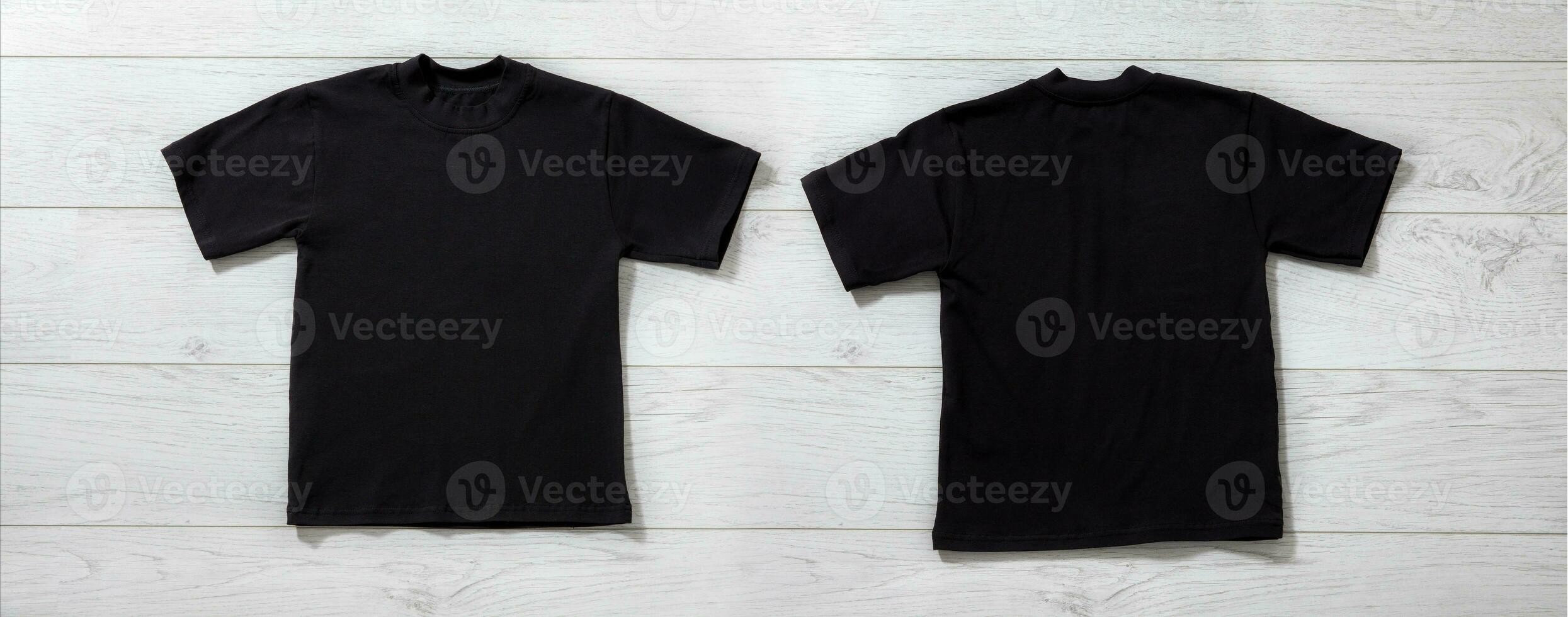 Front and back views on boys t-shirts on white wooden desk background. Mockup for design closeup photo
