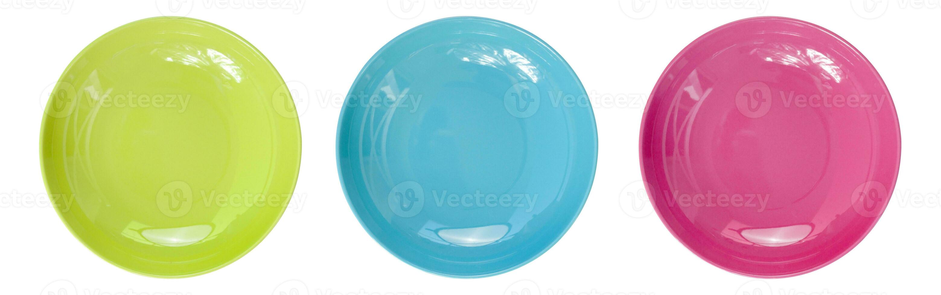 Top view of empty colorful plates isolate on white background photo
