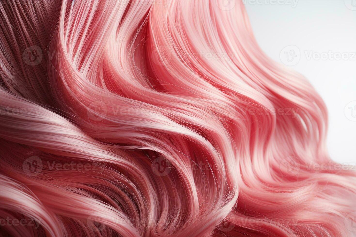 Pink hair close-up. Women's long pink hair. Beautiful styling of wavy shiny curls. Hair coloring. Hairdressing treatments photo