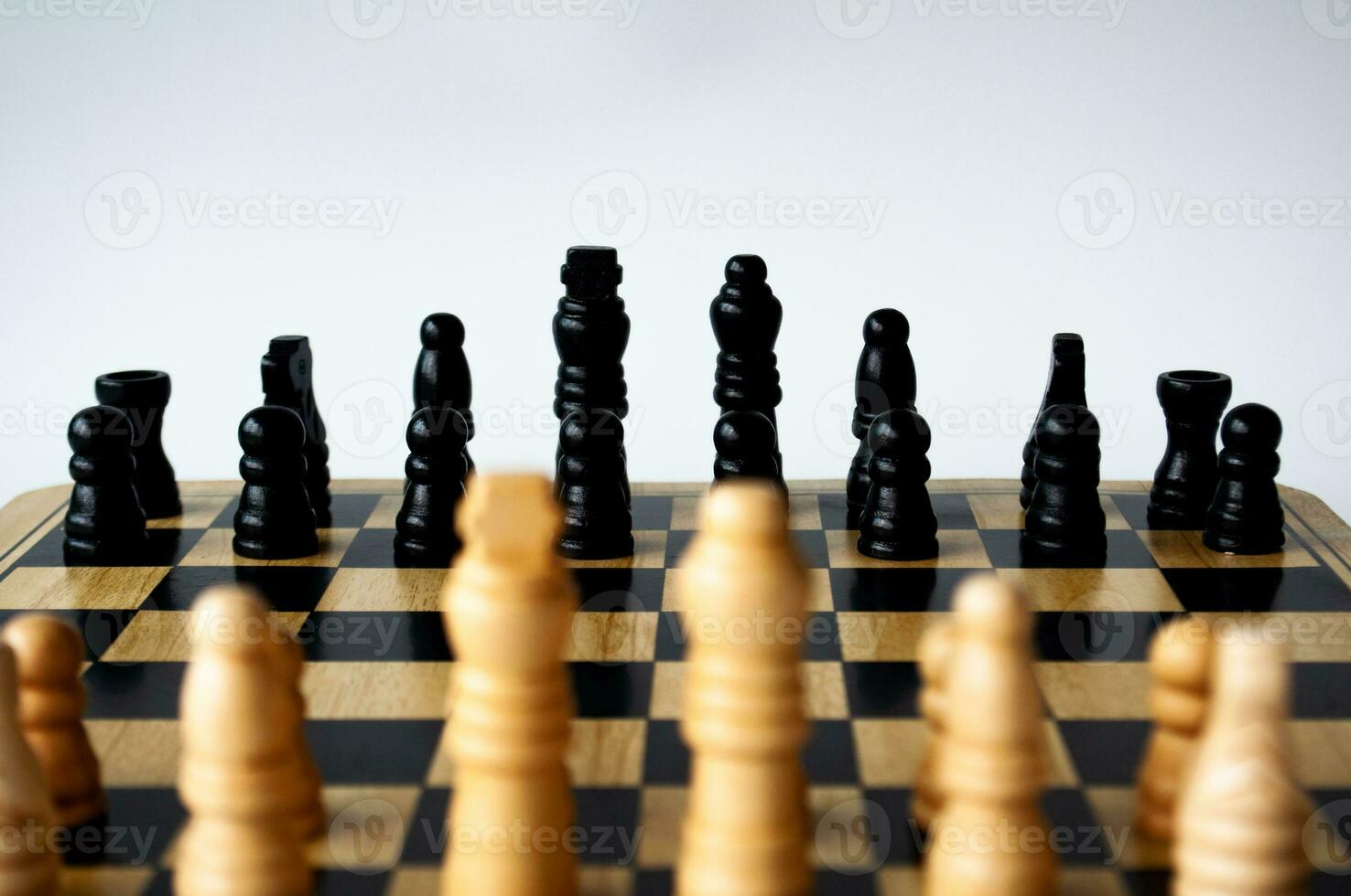 Battle between white and black chess on a chess boar. Strategy and tactics concept photo