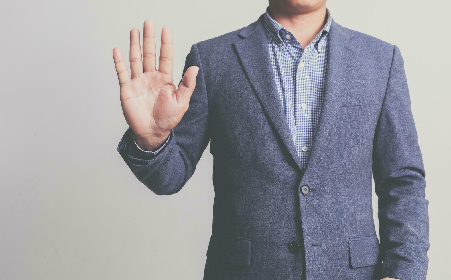 Businessman wearing a suit on a white background photo