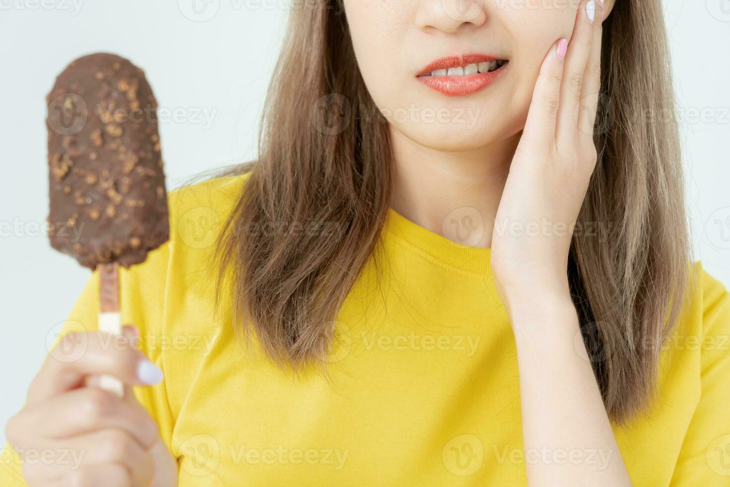 Asian woman feel sensitive teeth after eating ice cream, female suffer tooth, decay problems, dental care, tooth extraction, decay problem, bad breath, Gingival Recession, Oral Hygiene instruction photo