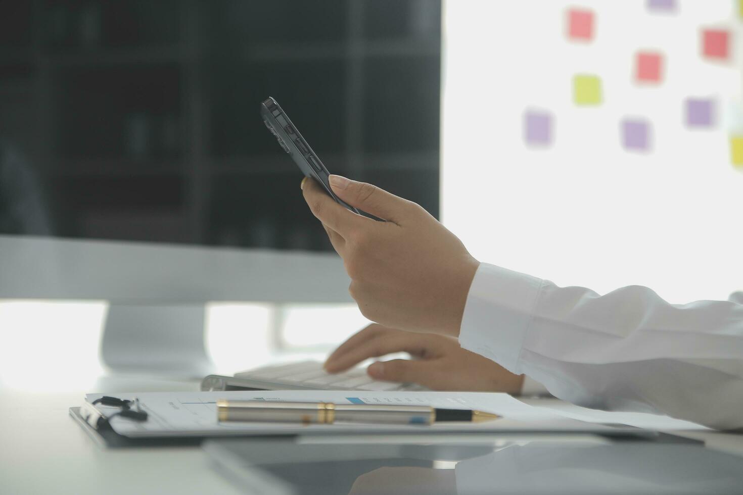 Close up Business woman using calculator and laptop for do math finance on wooden desk, tax, accounting, statistics and analytical research concept photo