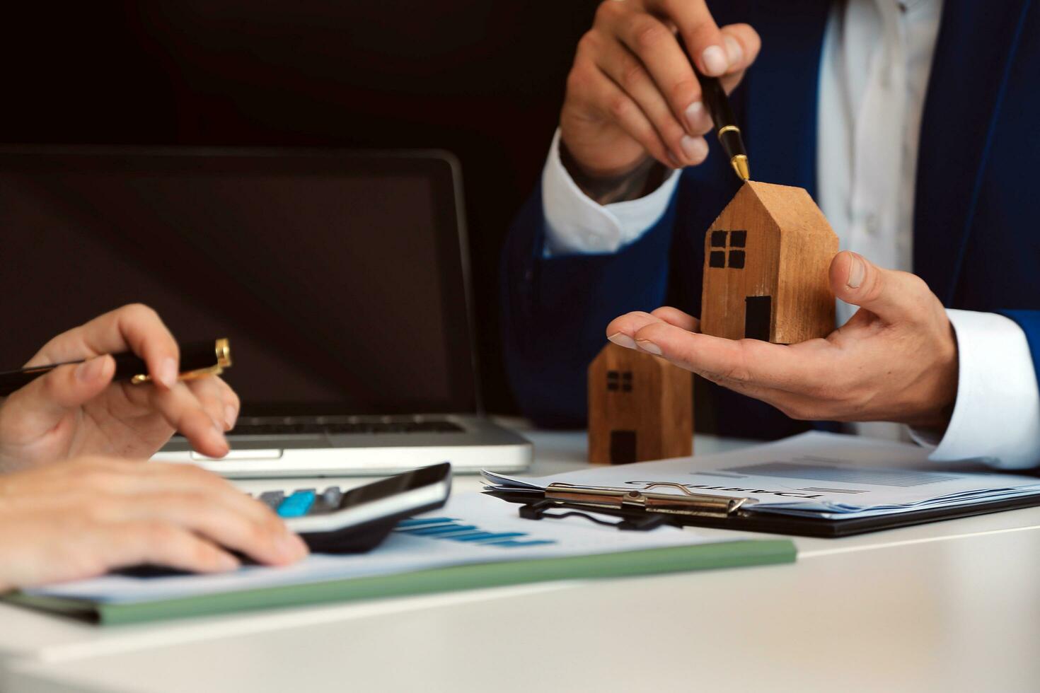 Female woman hands holding home model, small miniature white toy house. Mortgage property insurance dream moving home and real estate concept photo