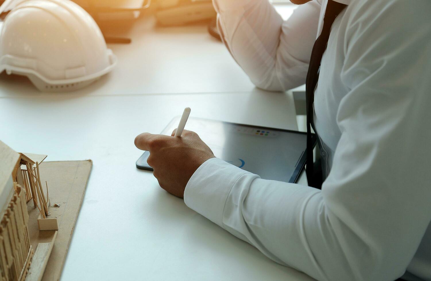 Construction and structure concept of Engineer or architect meeting for project working with partner and engineering tools on model building and blueprint in working site, contract for both companies. photo