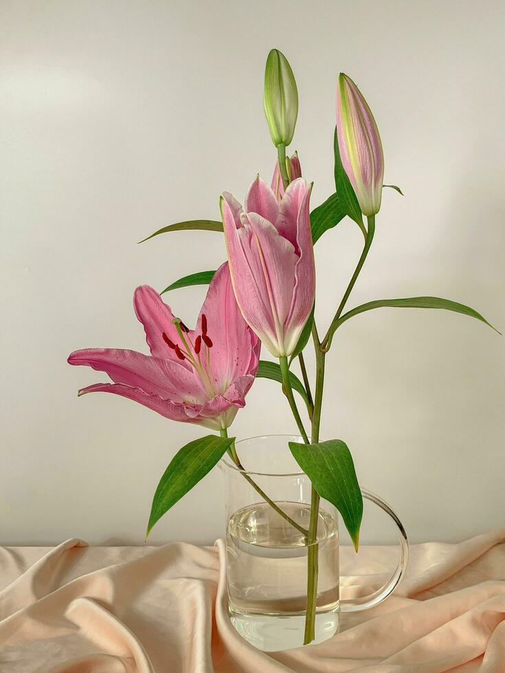A pink flowers in a glass vase photo