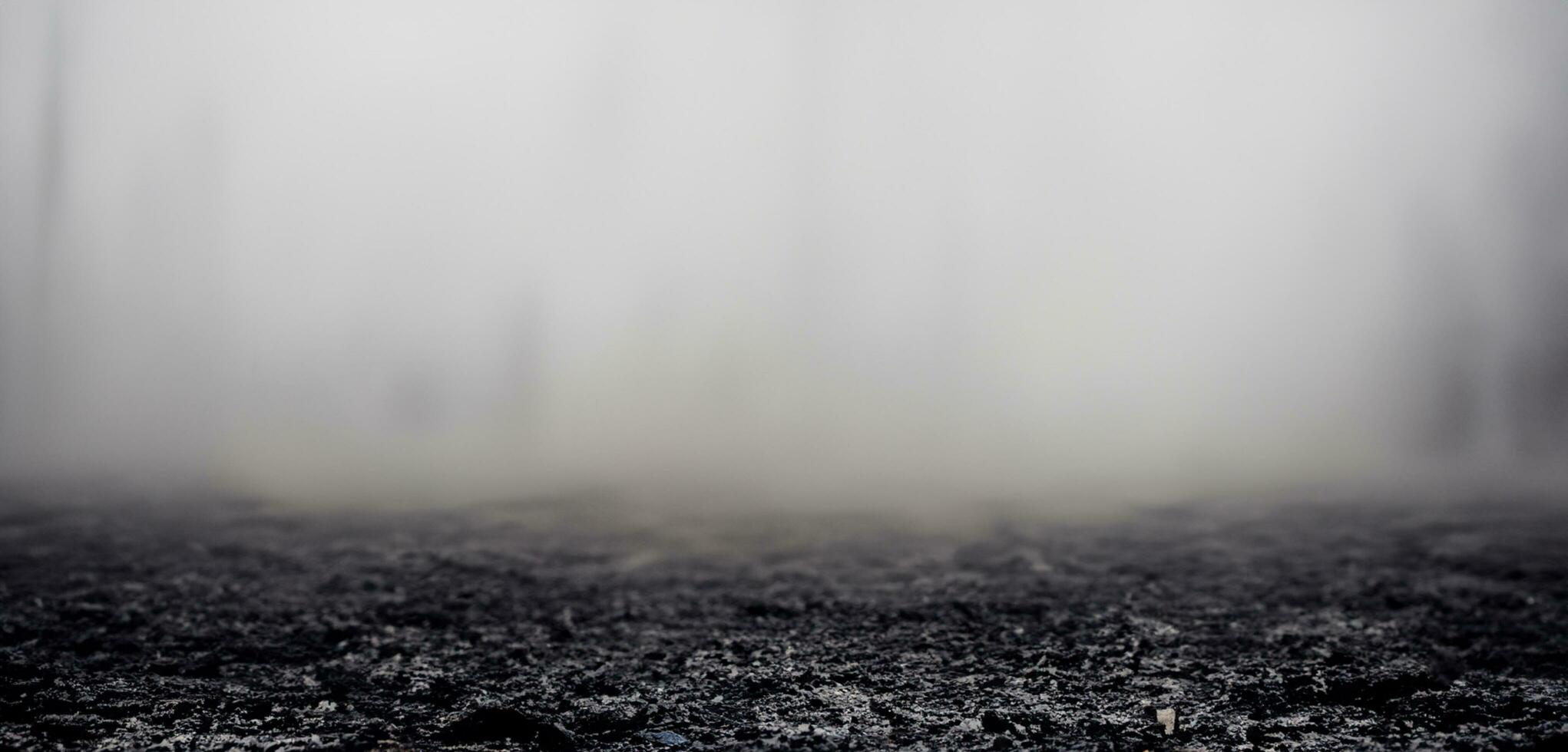 the ground smoke in the dark dark land background cracked ground scary photo