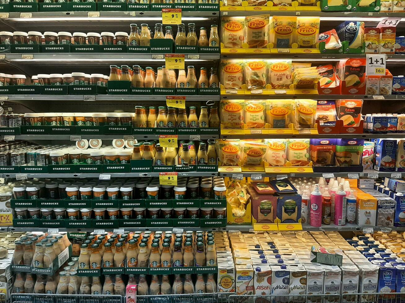 Mecca, Saudi Arabia - June 29, 2023. Variety of coffees and dairy products on the shelves in Bin Dawood  hypermarket in Shisha, Mecca. Beverages and dairy products in supermarket rack. photo