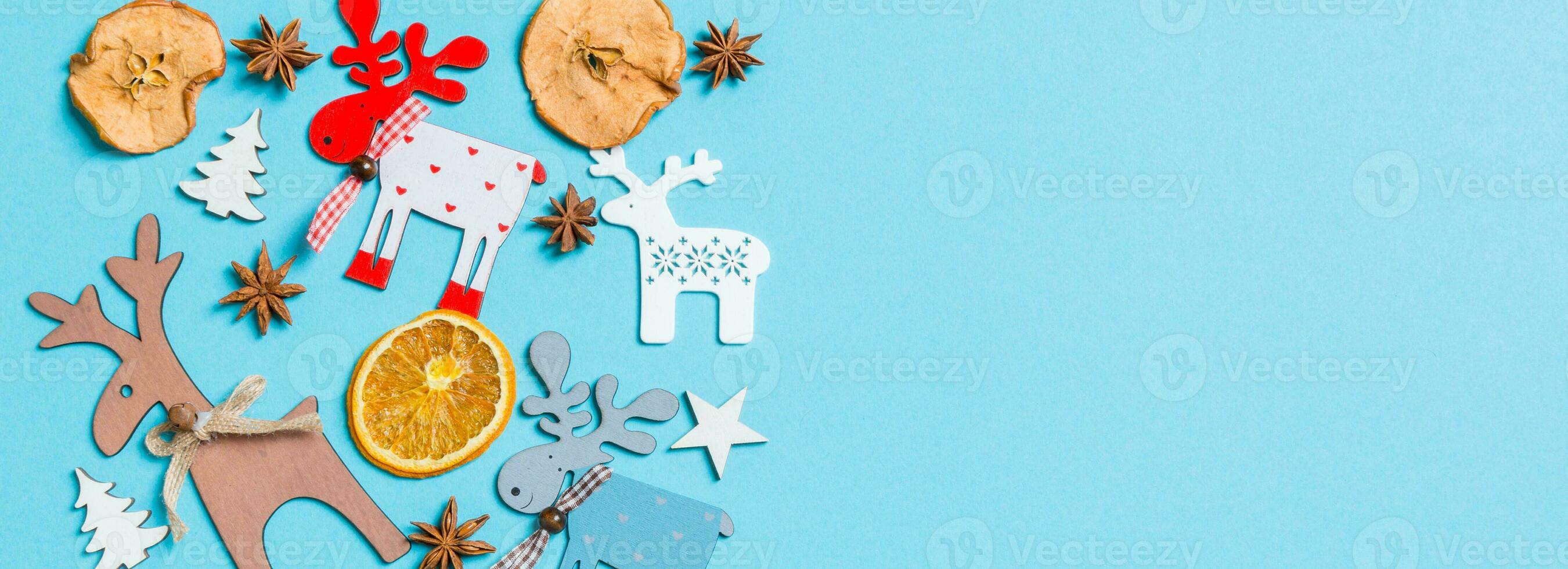 Top view Banner of holiday decorations and toys on blue background. Christmas ornament concept with empty space for your design photo