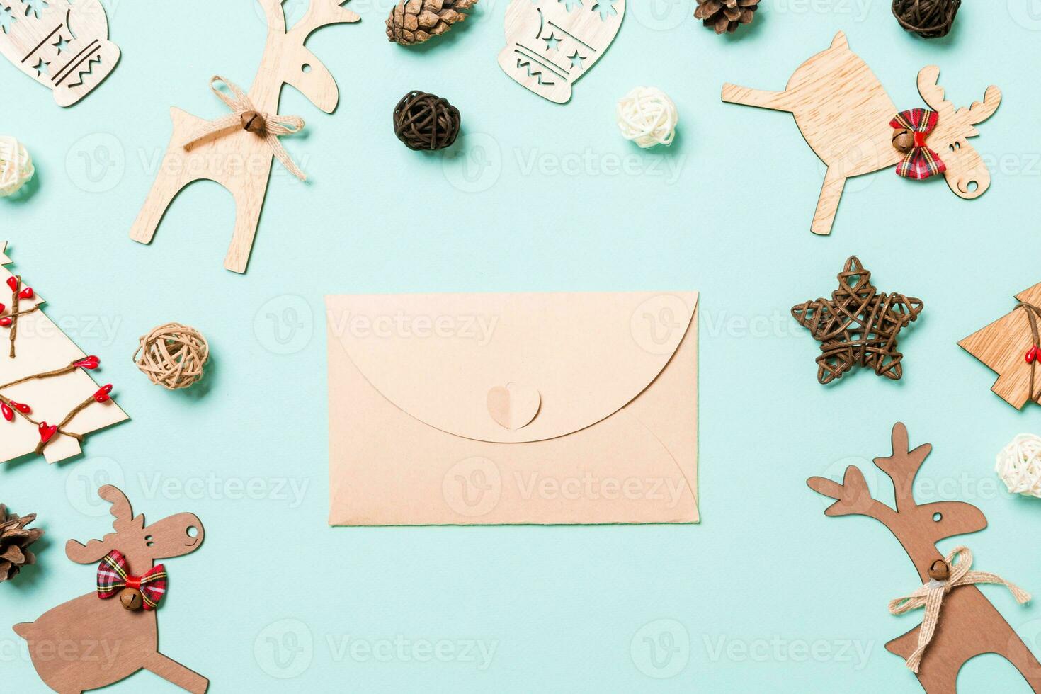 Top view of envelope on blue background. New Year decorations. Christmas holiday concept photo