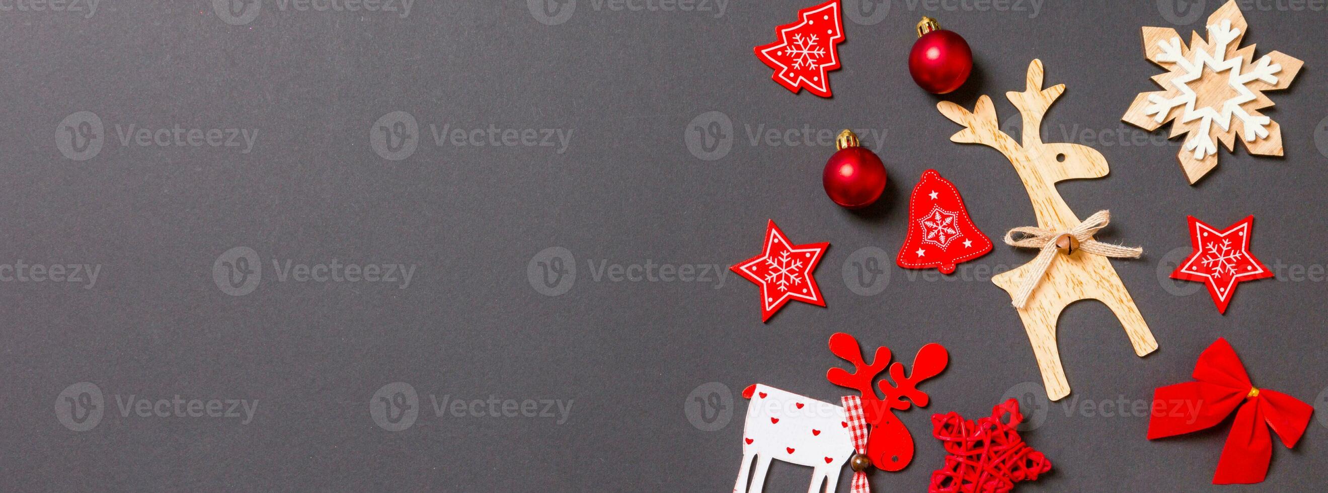 Banner Christmas black background with holiday toys and decorations. Happy New Year concept with empty space for your design photo