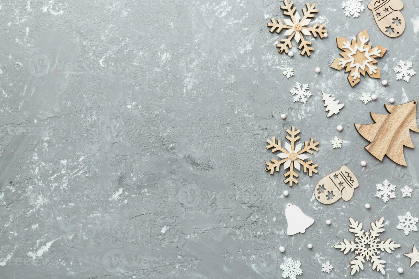 New Year composition white christmas snowflakes. Christmas decor background with pine cones. Top view with copy space photo