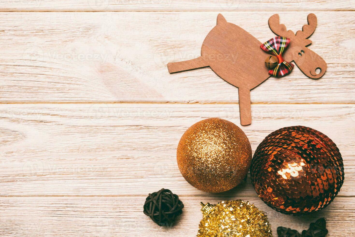 Winter set made of Christmas balls and various decorations on holiday wooden background. Top view of New Year concept with copy space photo