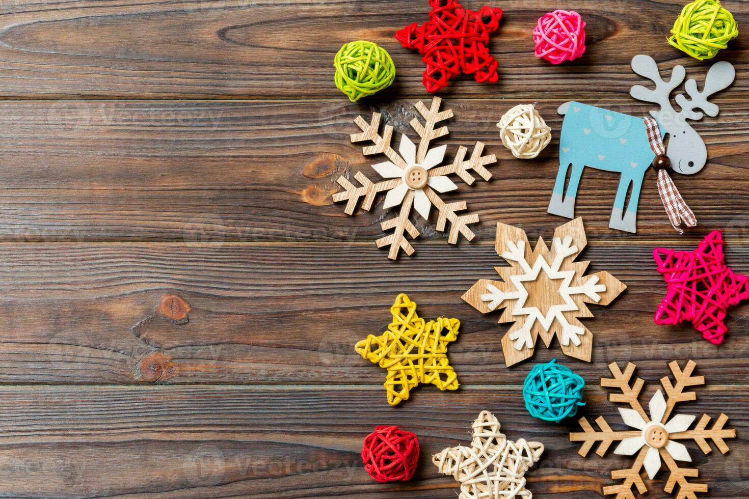 Top view of Christmas decorations and toys on wooden background. Copy space. Empty place for your design. New Year concept photo