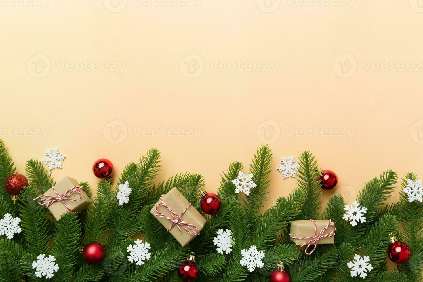 Christmas decorations and fir tree branch and gift boxon dark table. Top view frame with copy space photo