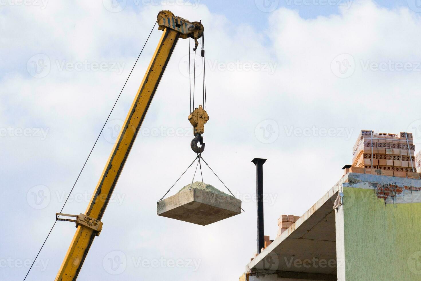 Industrial background made of crane construction at the buildings background at the building area photo