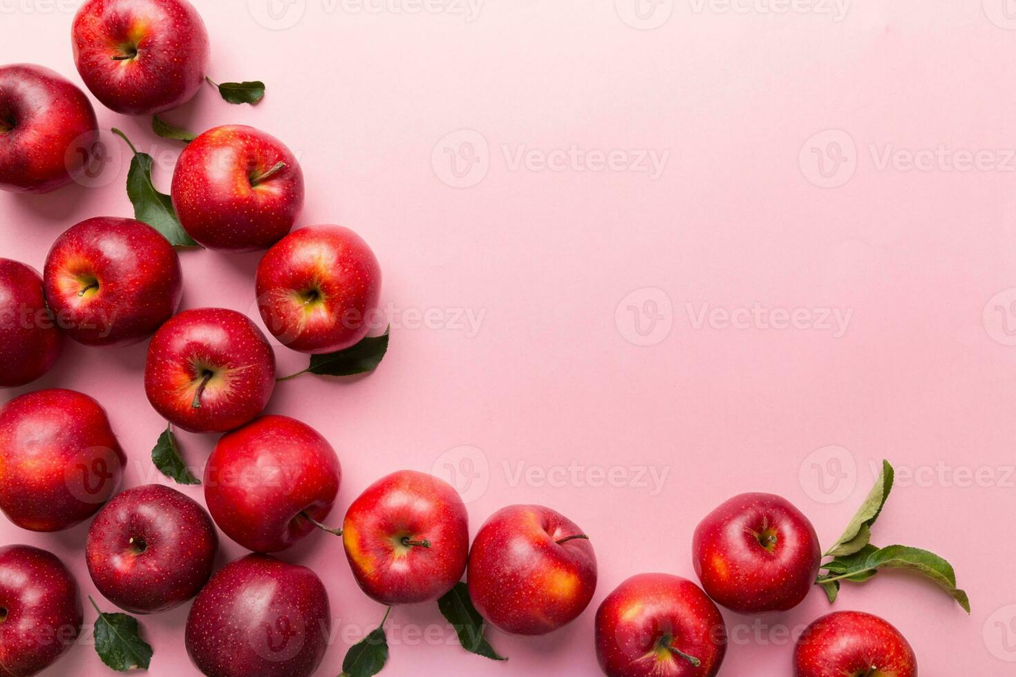 Many red apples on colored background, top view. Autumn pattern with fresh apple above view with copy space for design or text photo