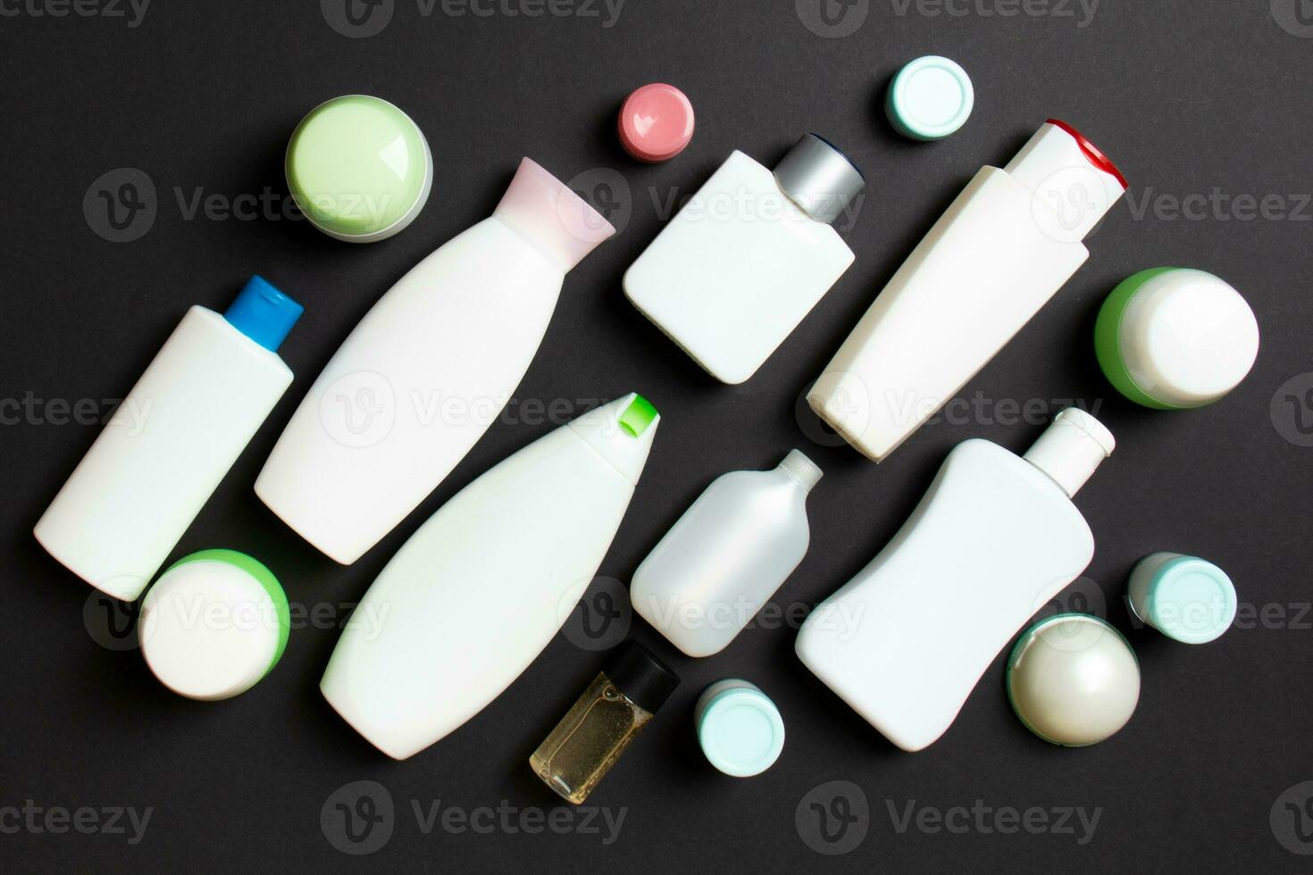 Group of plastic bodycare bottle Flat lay composition with cosmetic products on colored background empty space for you design. Set of White Cosmetic containers, top view with copy space photo