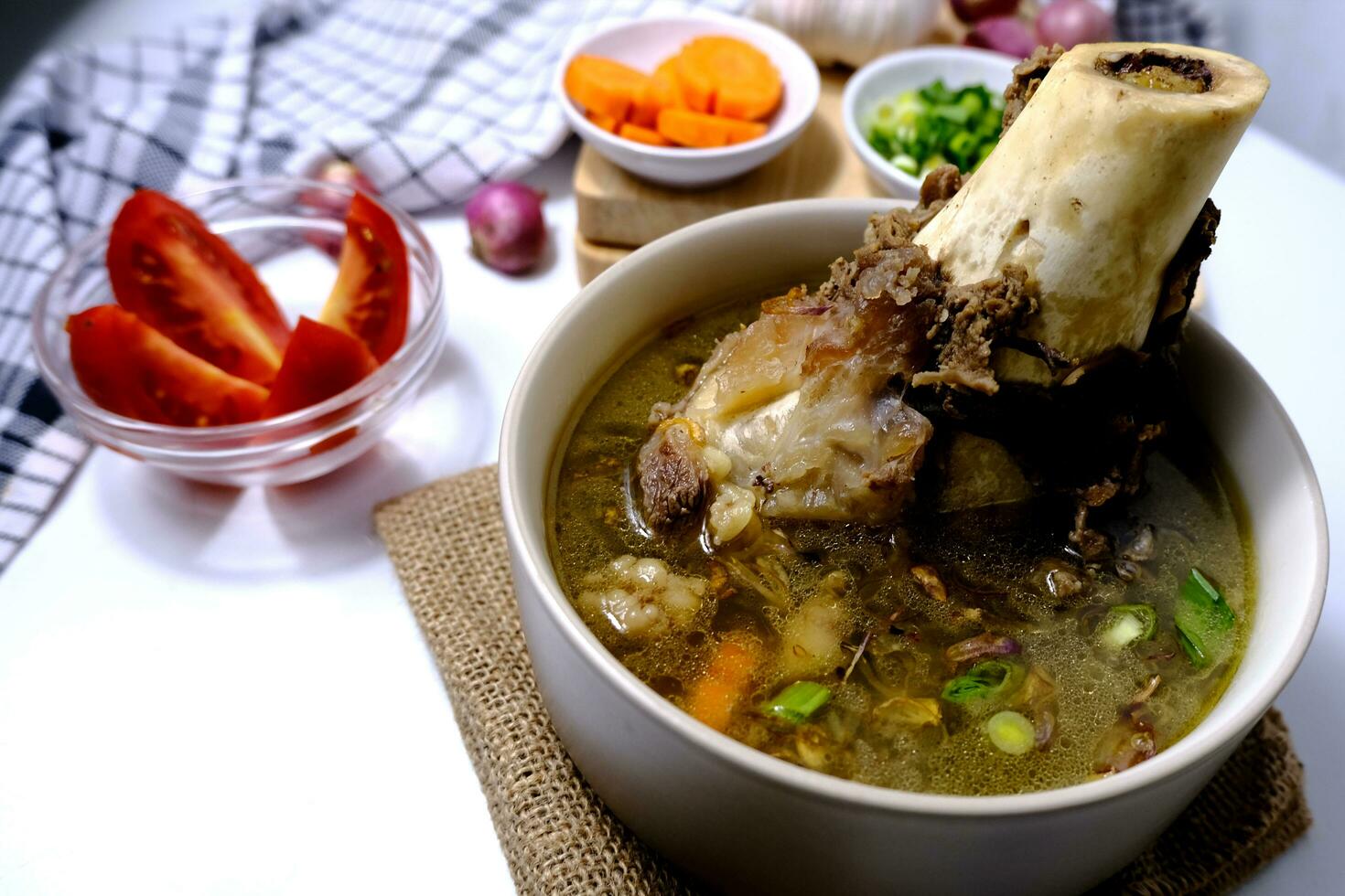 Bone soup or rib soup is a menu served in a bowl photo