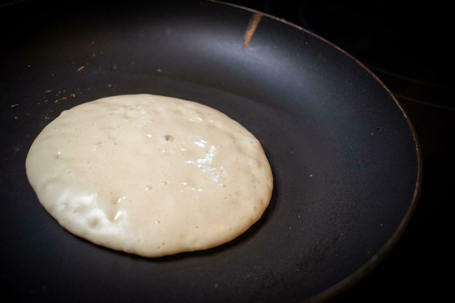 Pancake batter cooking photo