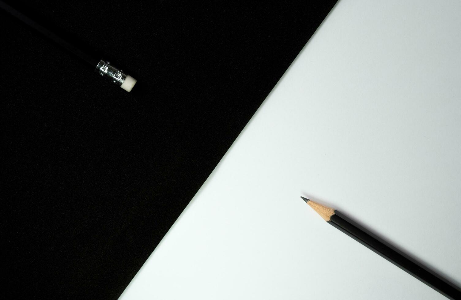 Wooden pencils, Black pencil turn pencil head to eraser of another pencil with black and white background, Contrast concept, School and office concept photo