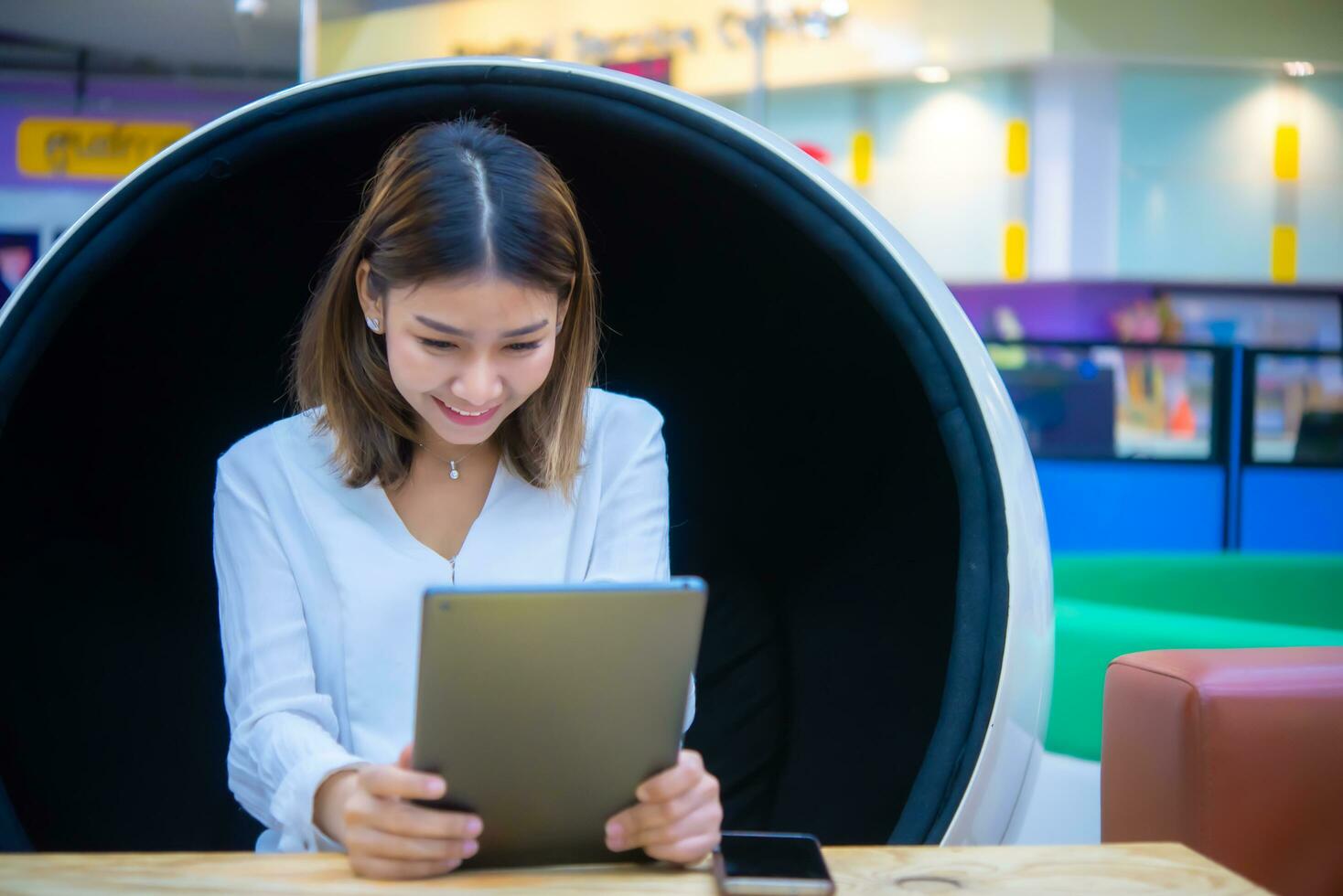 Her happy expression and confident posture suggest that she is a leader in the digital marketing space respected by her peers and clients alike, Digital marketing. photo