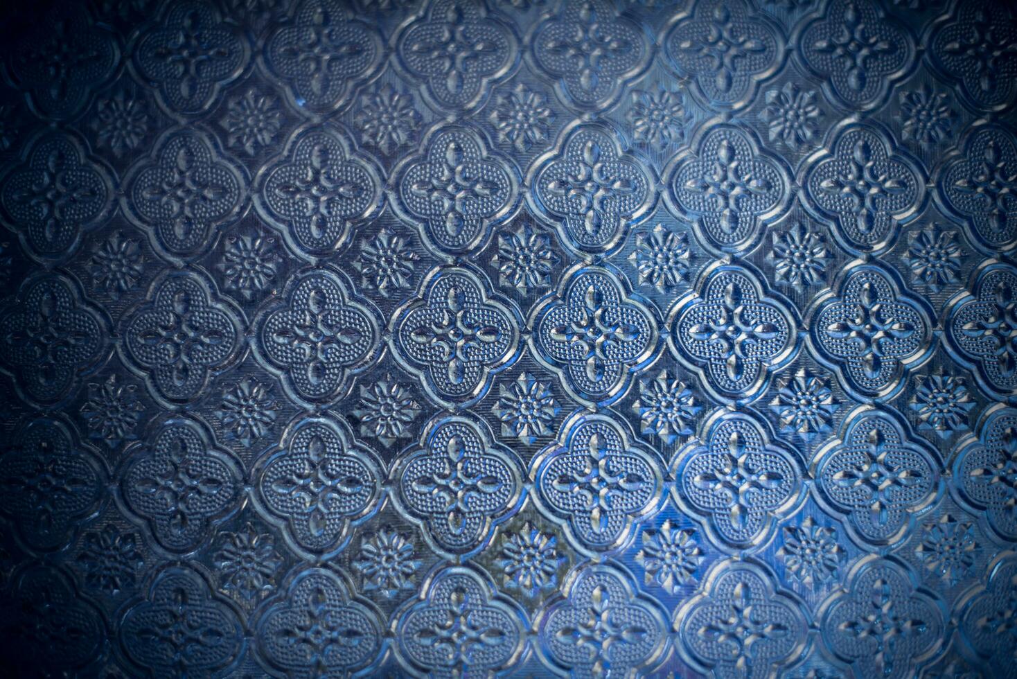 Beautiful flower pattern on blue glass-Image photo