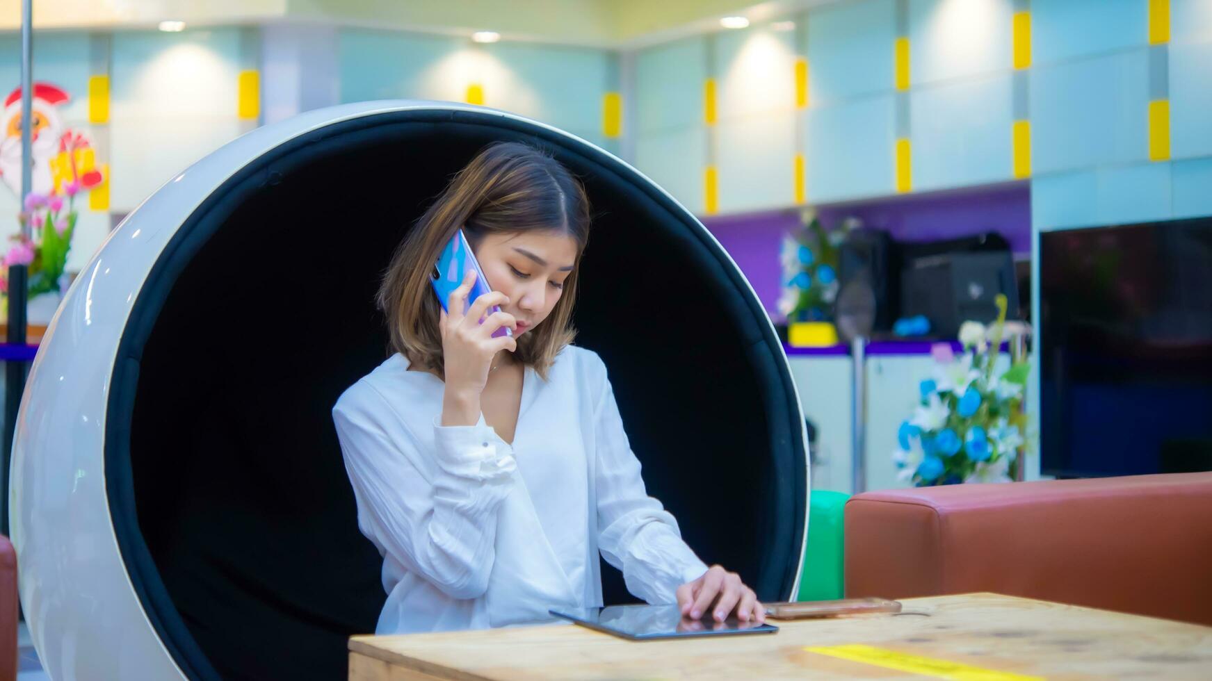 The serious expression on her face suggests that she is taking her work seriously and committed to achieving success, Digital marketing. photo