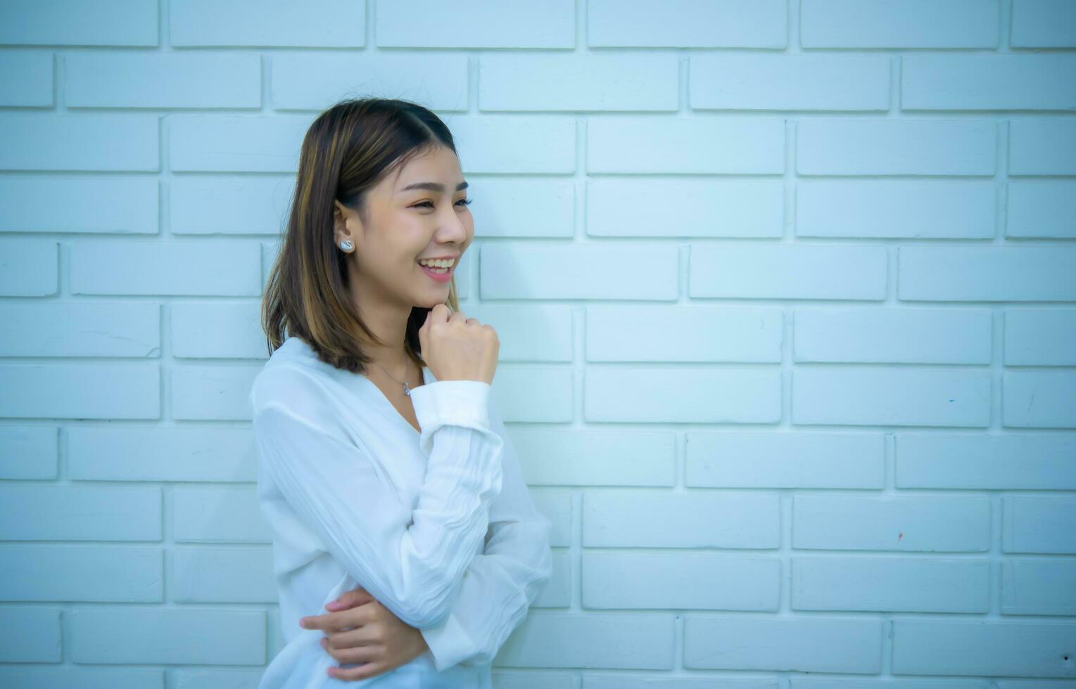 Beautiful asian business woman crossed arms convey a sense of confidence and readiness to take on any challenge, Digital marketing. photo