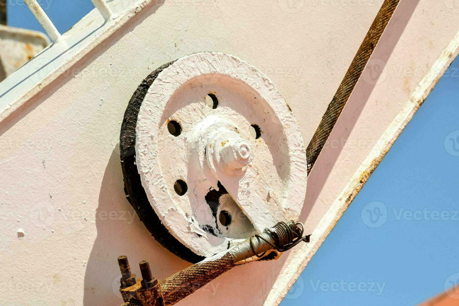 Rusty metal pulley photo