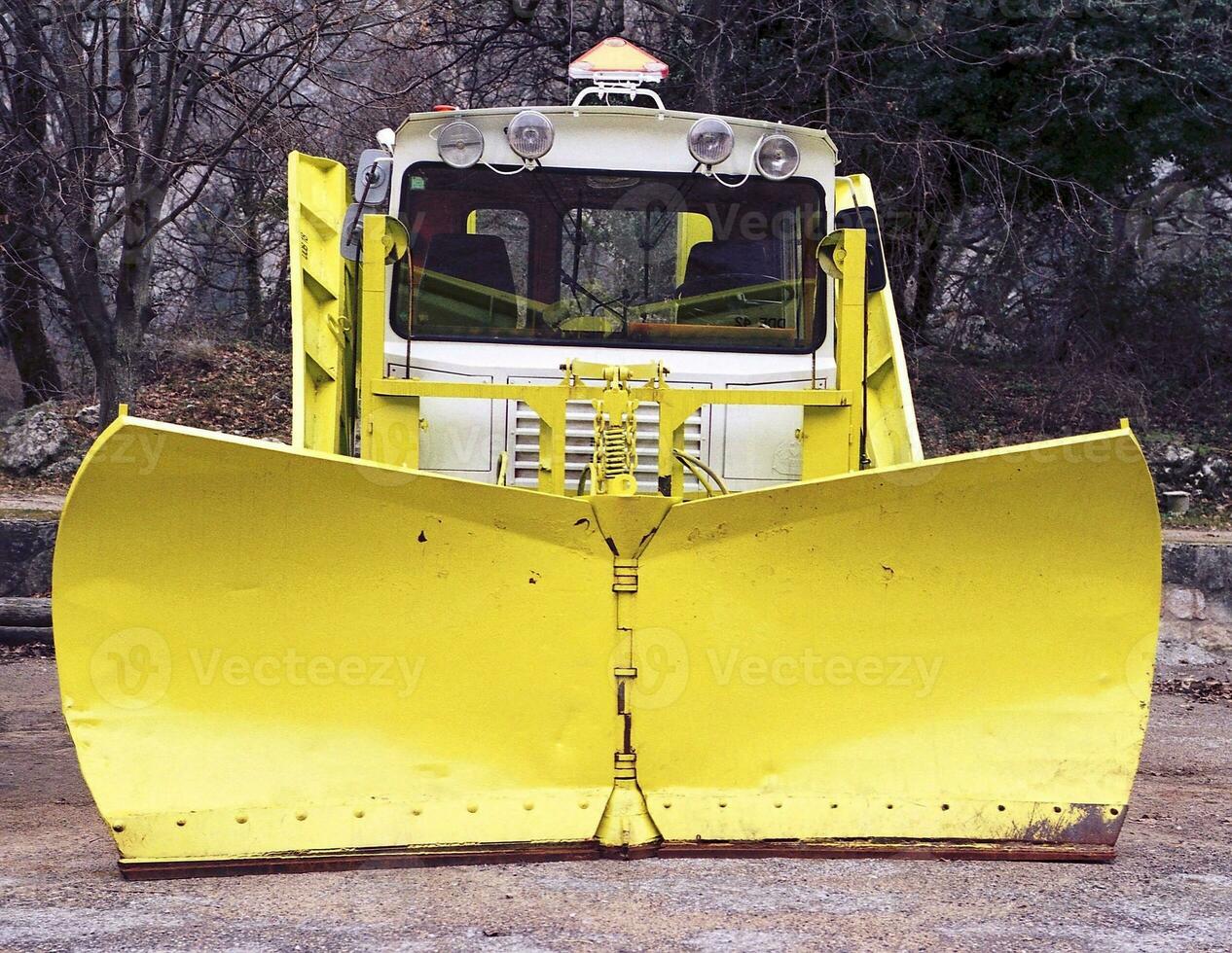 Snowplow at Rest Off Season Outdoor Parking photo