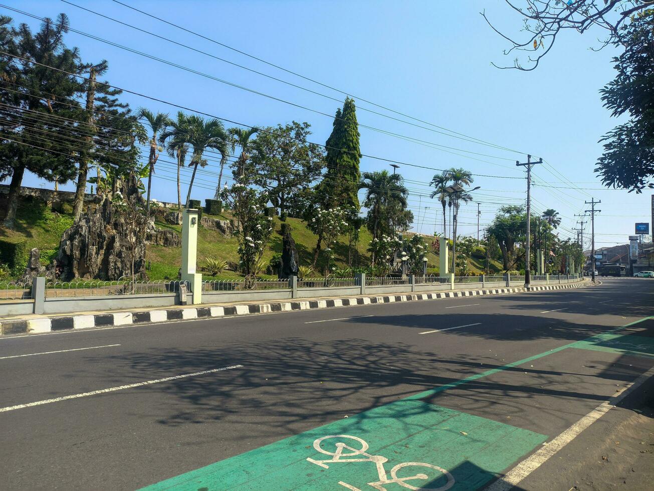 a quiet street during the day on Jalan Magelang photo