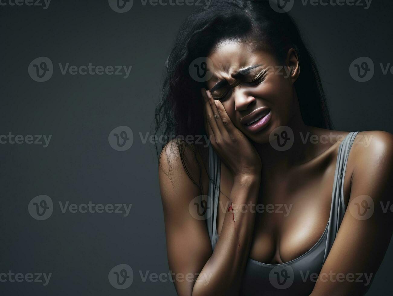 Black woman appears to be in pain on grey background AI Generative photo