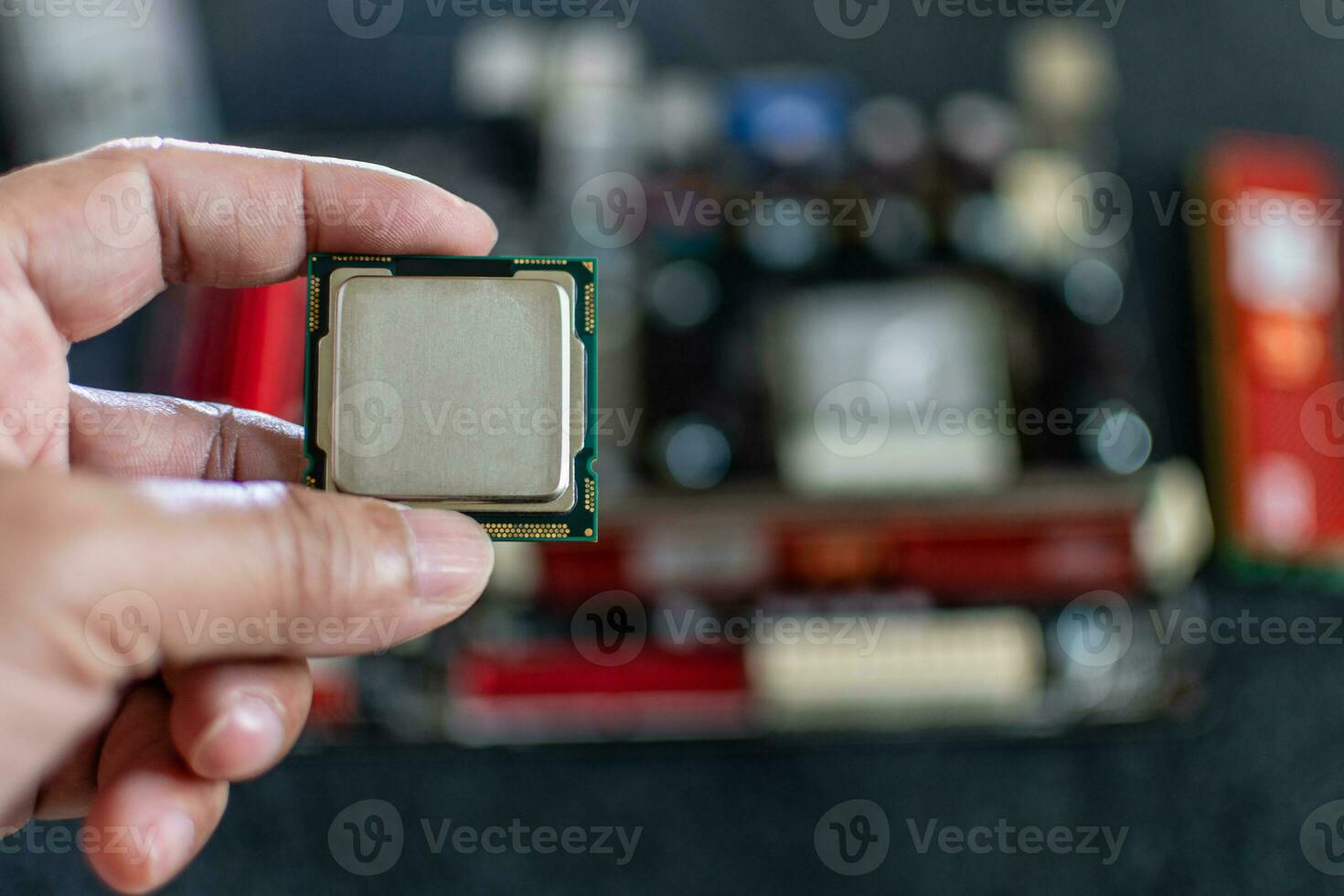 Closeup, Man holding CPU, Central processor Unit, Concept for fix, repair, mend,  restore, service, cobble, retrieve, recondition, selective focus, copy space on right for design, blurred background photo