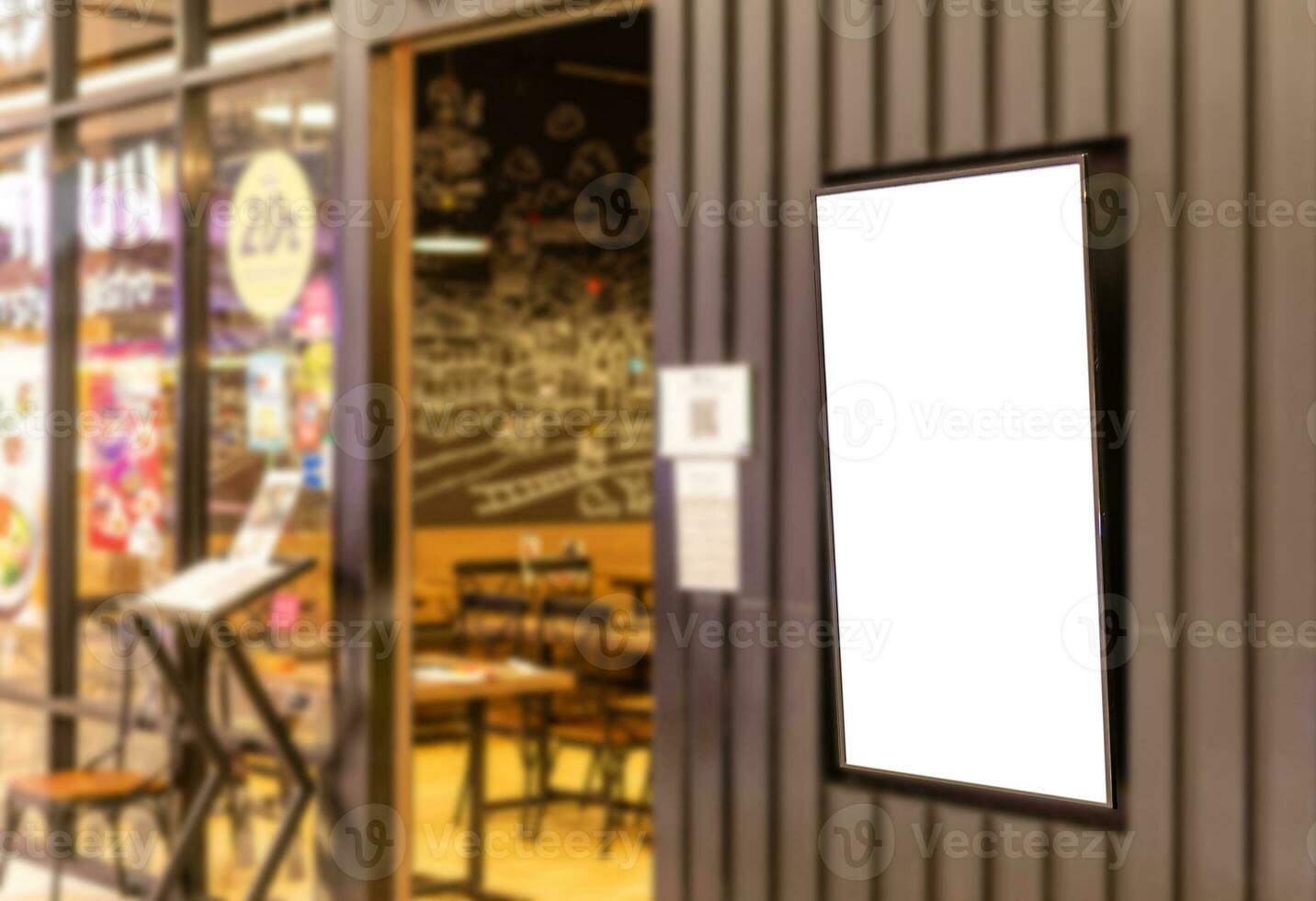 Blank white broad in front of a food shop in a shopping center, concept, advertisement, promotion, information. closeup, selective focus, blurred background photo