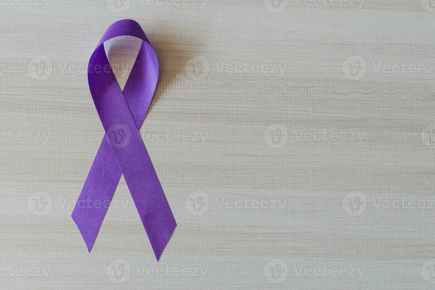 International Overdose Awareness Day. The purple ribbon on the wooden background photo