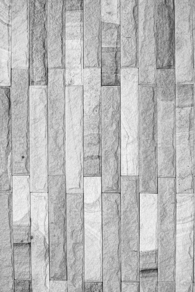 Grunge, Black and white modern stone wall background Beautiful details and patterns. Close up and vertical image. photo