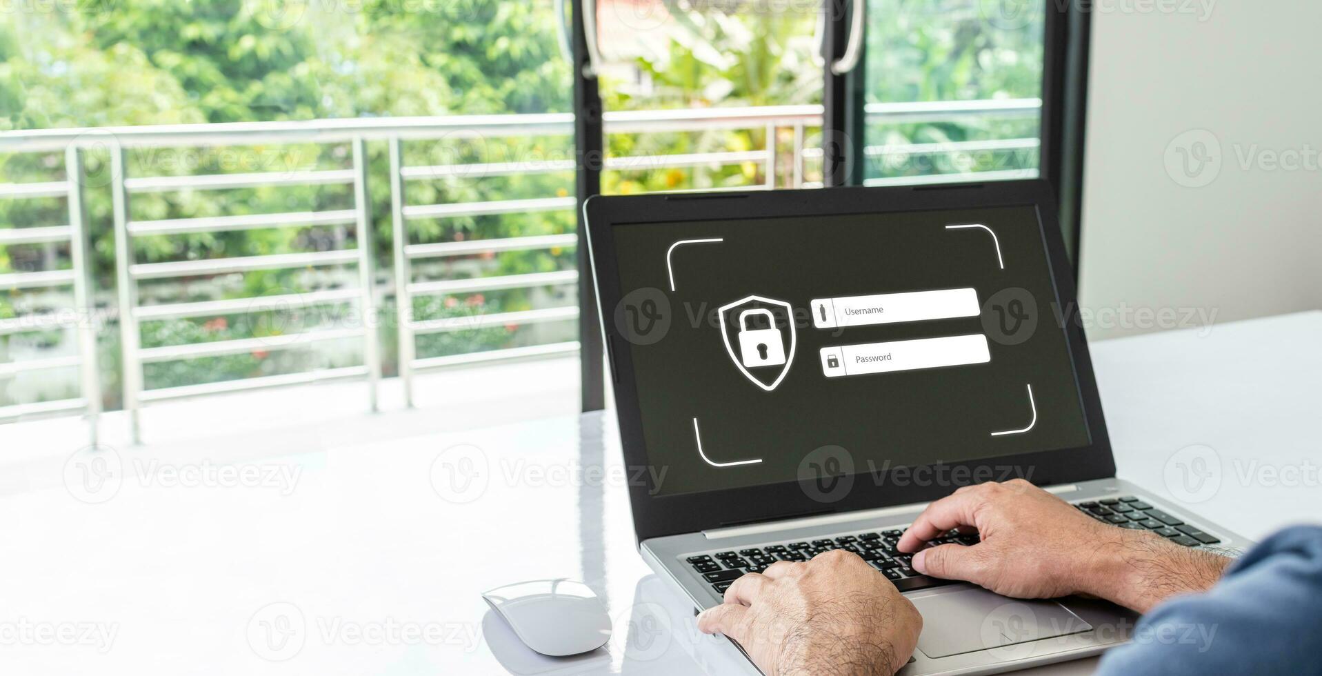 Man typing username and password with a laptop to log into the system. Concept of using technology to work in various fields of finance, banking,  network, working at home, internet. blur background photo