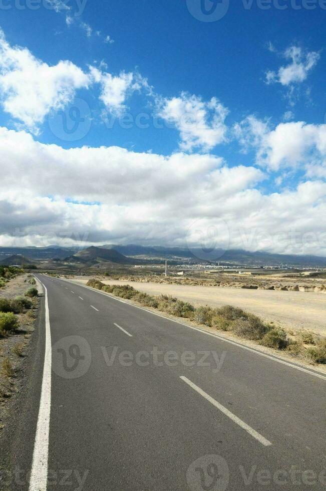 Road through the scenic landscape photo