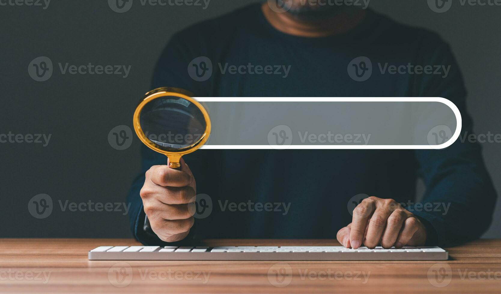 Hand of businessman holding of magnifying glass, working with computer laptop in office. Searching Browser Internet Data Information with search job. Search Engine Optimization SEO Networking Concept. photo