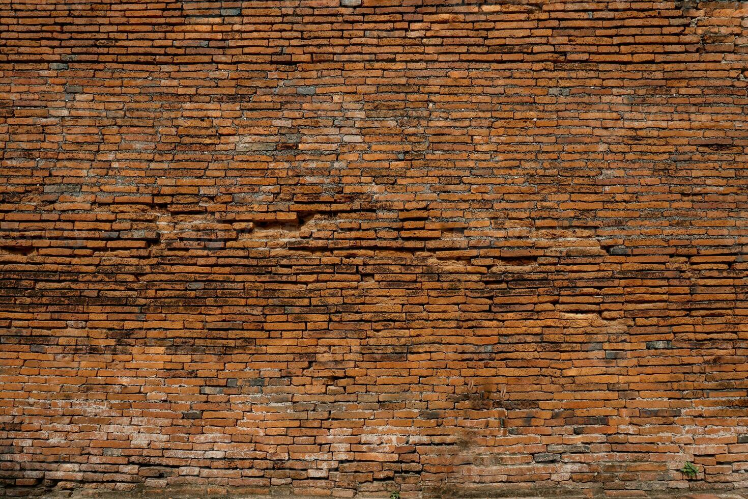 Old red brick wall texture for the background. photo