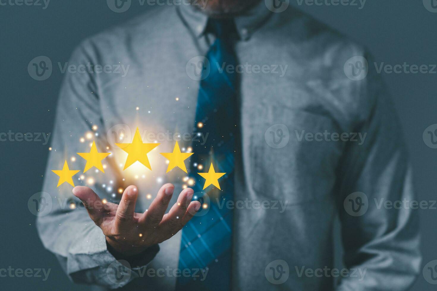 hand of customer or businessman holding stars to complete five stars for satisfaction service mind. he smiles and is happy before giving five star rating. Service rating, satisfaction concept. photo