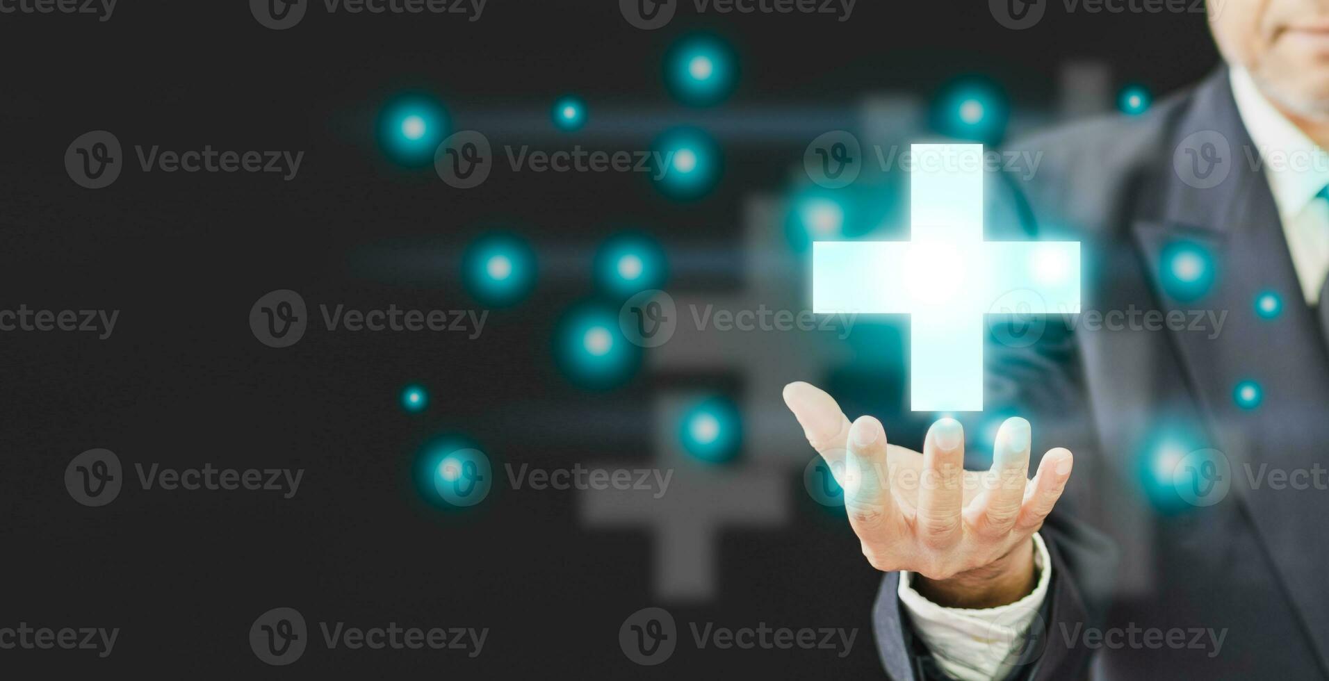 professional Businessman hand holding symbol cross shape with the shield icon and over gradient light blue, copy space on left, Business healthy and medical care insurance concept, black background photo