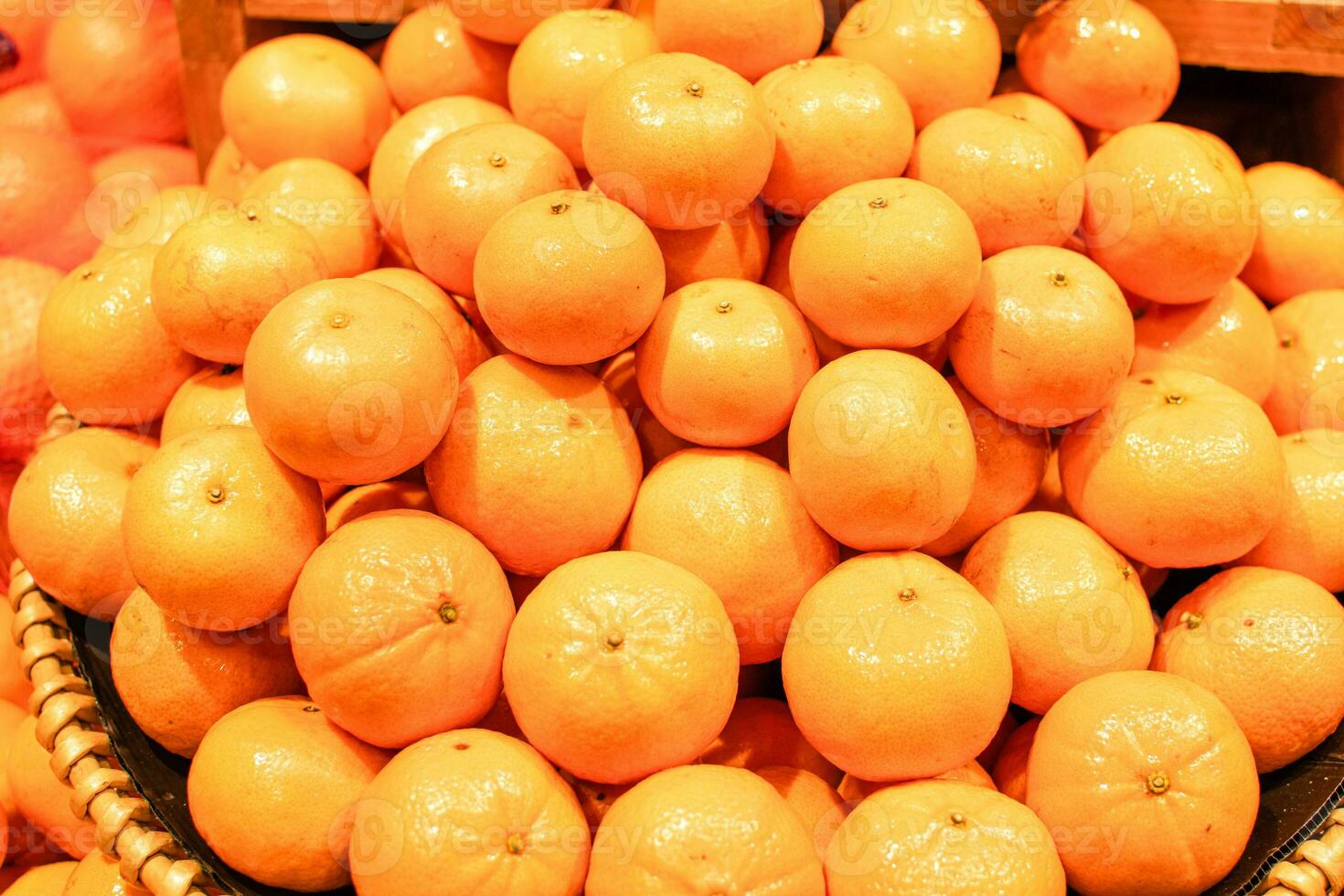 group oranges on the basket in the department store, the photograph is close up and landscape photo