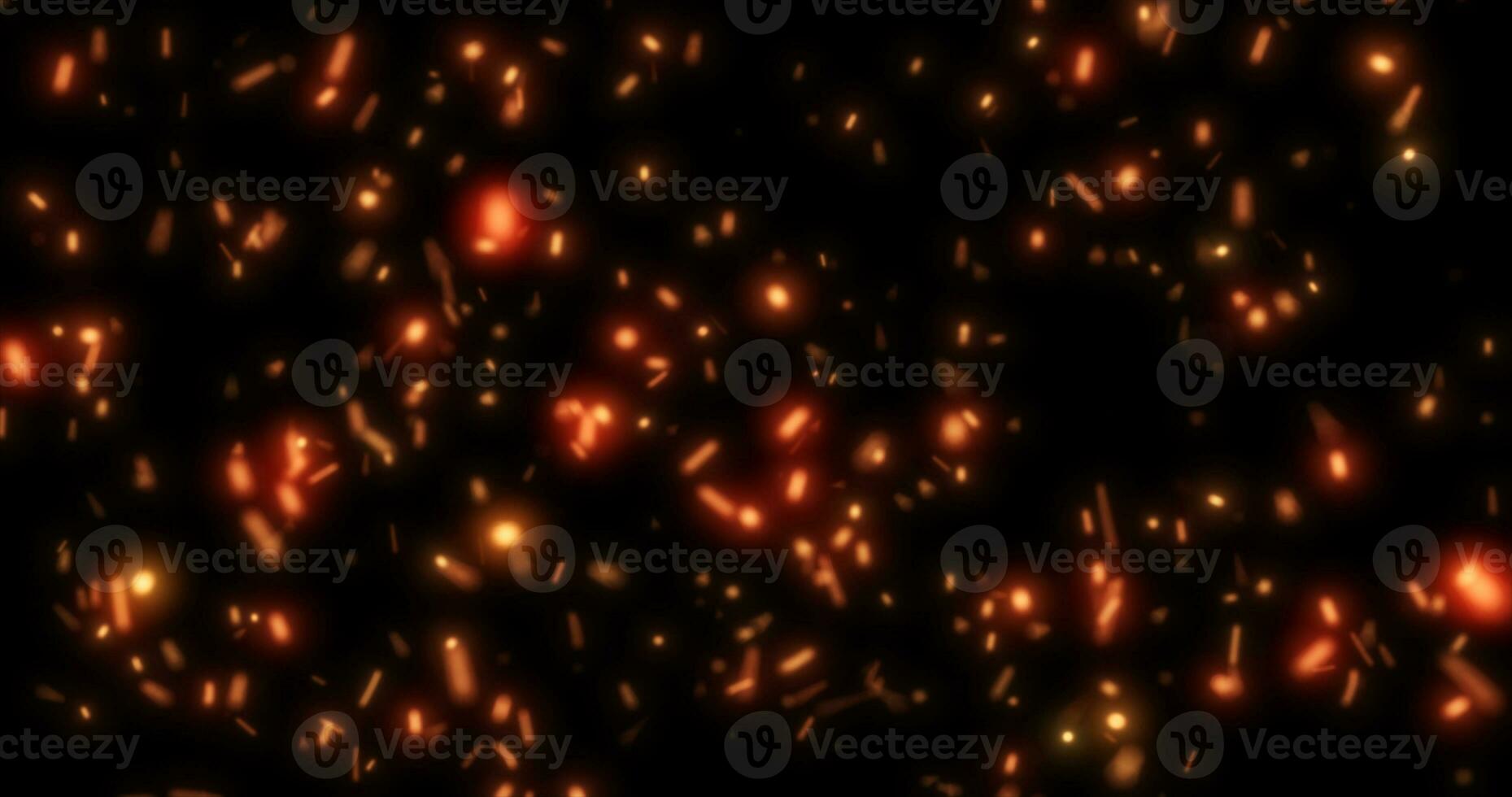 Abstract bright background of flying yellow glowing orange fire sparks from a fire on a black background photo